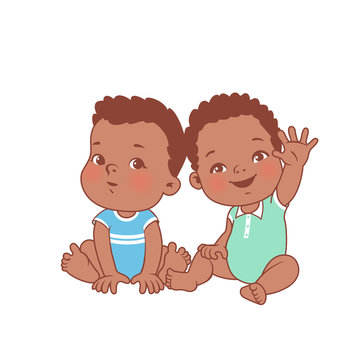 Cute little baby boys sitting on white background. 