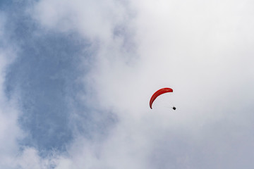 Tandem flight high up in the sky with a few clouds