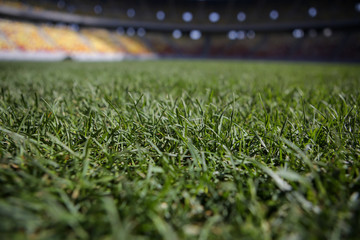 Details with the freshly installed and trimmed new turf on a soccer stadium