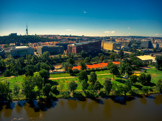 aerial flight over vltava river next to bridges sunny day of summer in Prague