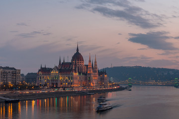 Naklejka na ściany i meble Aerial view of Budapest parliament and the Danube river at sunset, Hungary.