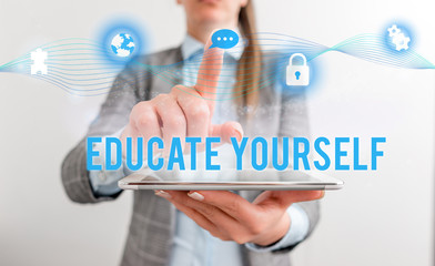 Conceptual hand writing showing Educate Yourself. Concept meaning prepare oneself or someone in a particular area or subject Female human wear formal work suit presenting smart device