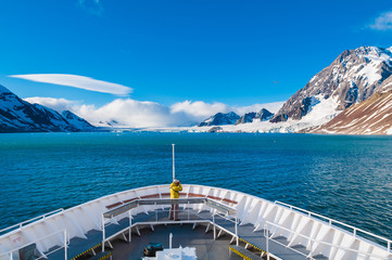 Photographer on the bow of a cruise ship in Svalbard, Norway.