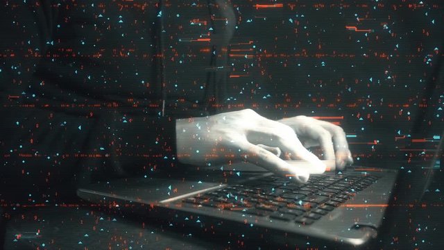 Programmer hands typing on laptop keyboard closeup. Digital background on topic of computer security on the Internet and people breaking law in field of system hacking. Professional cracker servers.