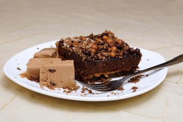 Chocolate cake with ice cream. A piece of sponge cake and coffee ice cream