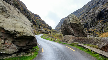 curved road on a rocky mountain, gap of dunloe, ireland
