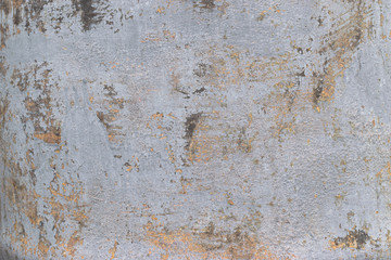 Fototapeta premium Old gray concrete wall with yellow and brown spots as an abstract background