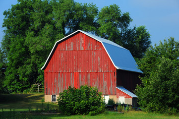 Boards on Red Barn are Cracked and Peeling