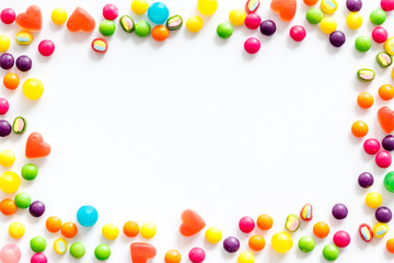 Assorted sweets and marmalade frame on white background top view space for text