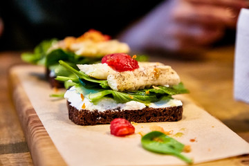 Bruschetta with fried fish and cream cheese