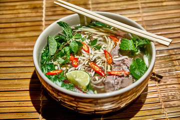 Traditional Vietnamese soup, Pho Bo in a large bowl.