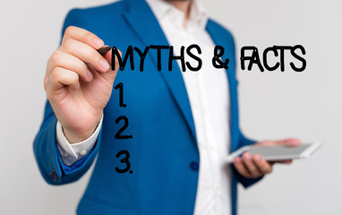Conceptual hand writing showing Myths And Facts. Concept meaning usually traditional story of...