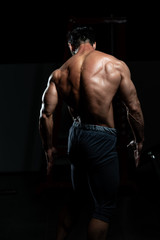 Fototapeta na wymiar Physically Mature Man Showing His Well Trained Back