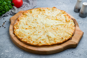 khachapuri with cheese on beautiful grey table