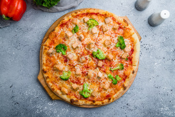 Pizza with salmon and broccoli on beautiful grey table