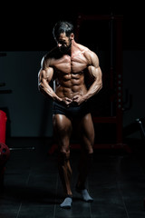 Obraz na płótnie Canvas Man In Gym Showing His Well Trained Body