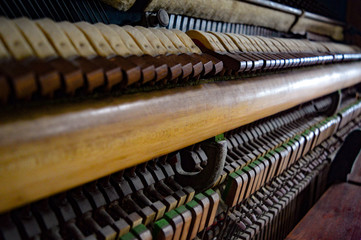 The inner workings of a vintage piano 