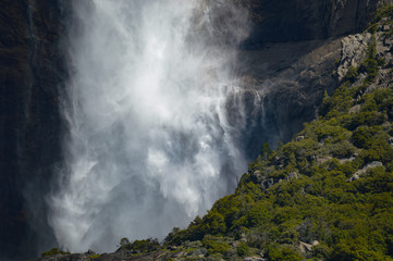 Focused view of Yosemite waterfall cascading over a ledge