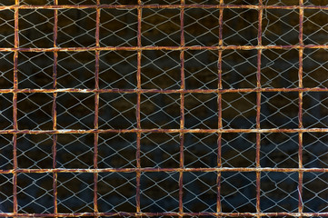 fencing made of rusty lattice and mesh