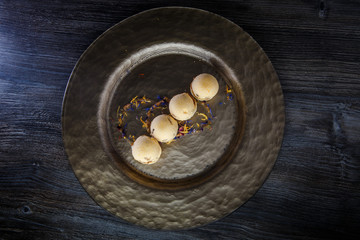 top view on four spherical sponge biscuits decorated with flowers