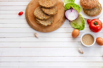 quinoa vegetable burger with  tomato and onion