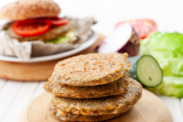 quinoa vegetable burger with tomato and onion