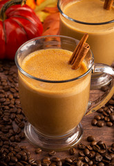 A Pumpkin Spice Latte on a Rustic Wooden Table