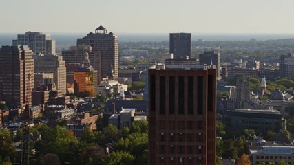 New Haven Connecticut Aerial v7 Panning away from close up of Yale university tower to wide campus view with building in foreground - October 2017