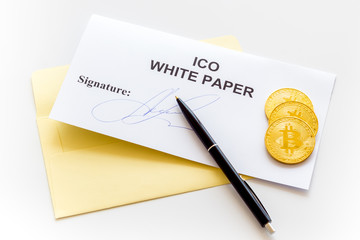 White paper ICO, coins, pen on white background