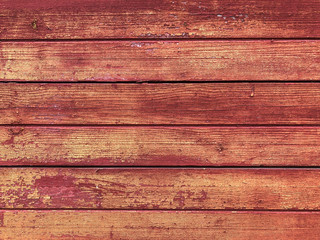 Wood background with red paint. Old paint on a wooden surface. Wall boards made of wood. Floor, closeup texture.