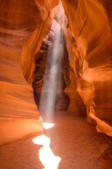 Light beams in Upper Antelope Canyon during midday photography tour
