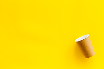 paper cups for coffee to take away on yellow background space for text