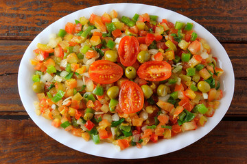 Vinagrete or Vinaigrette is a traditional Brazilian cuisine salad made with tomatoes, peppers, onions, vinegar, parsley and olives.