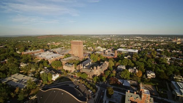 New Haven Connecticut Aerial v10 Short panorama flying in reverse with hockey rink and trees - October 2017