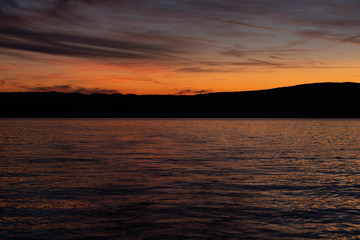 Scenic view of island during sunset, sea in the front and island in behind