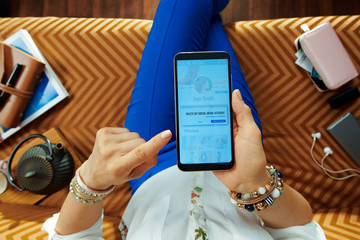 young housewife deleting social media account on smartphone