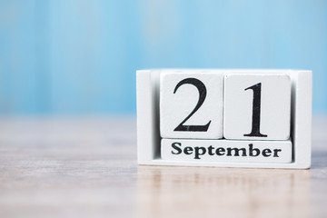 September 21 of white calendar wooden, International Day of Peace and World ALZHEIMER’ S day