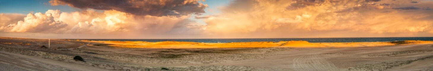 Fototapeta na wymiar Storm and sunset, Stockton Sand Dunes, NSW, Australia