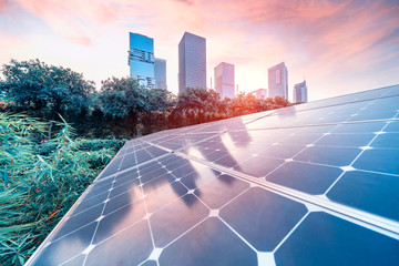 solar energy  panel plant with urban landscape landmarks,Ecological energy renewable concept.