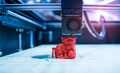 3D printer printing pig figure close-up.