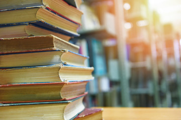 book stacked in library education concept back to school and business study with old books on a wooden table