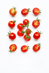 Fresh tomatoes, whole and half cut isolated on white background.