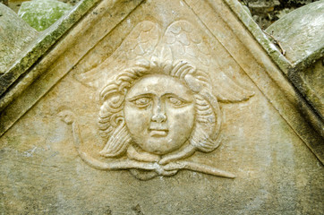 Ancient chubby angel carving
