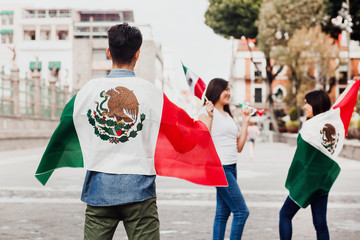 mexican guys cheering Viva Mexico on independence day in Mexico city