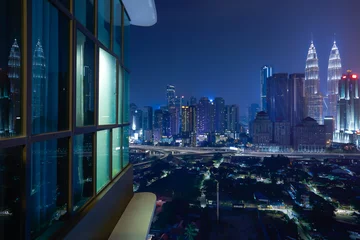 Foto op Plexiglas Night view of a beautiful cityscape with window reflection © jamesteohart