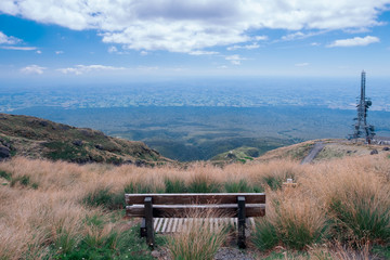 Fototapeta premium A bench with mountain view.