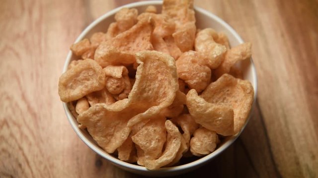 White Bowl of Fried chicharrones (pork rind)