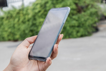 Close up woman hand using smart phone.Technology concept.