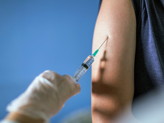 Injection, the doctor vaccinates the patient
