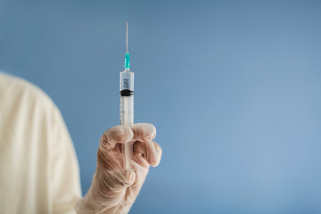 Injection, syringe in hand